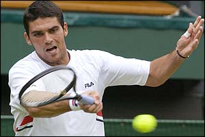 Mark Philippoussis in action during the opening set of his match with Sebastien Grosjean