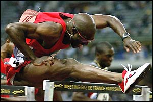 Allen Johnson competes in the 110m hurdles