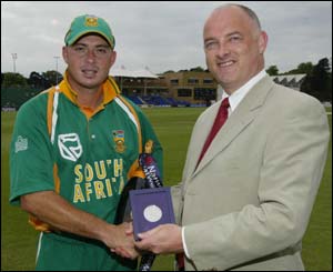 Herschelle Gibbs receives the man-of-the-match award from NatWest's director of commercial banking David Shelliday 