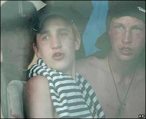 Russian fans look at the site of bomb blasts from a bus as they leave after the concert