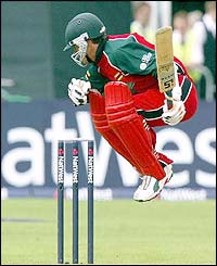 England's Charles Coventry jumps out of the way of a Jimmy Anderson delivery