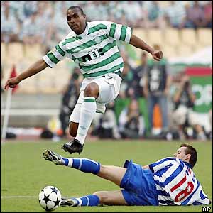 Celtic's Didier Agathe hurdles FC Porto's Maniche