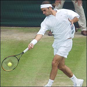 Roger Federer plays a forehand volley