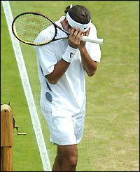Roger Federer cries after beating Mark Philipoussis