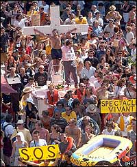 Artist performs mock crucifixion