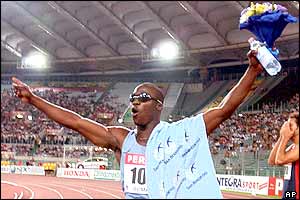 American John Capel celebrates his 100m victory