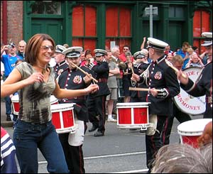 A woman dancing along with the bands