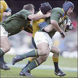 Pedrie Wannenburg charges at the Australian defence