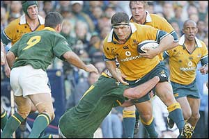 Australia's prop forward Patricio Noriega is tackled