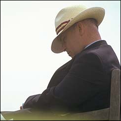 A racegoer sleeps at Glorious Goodwood