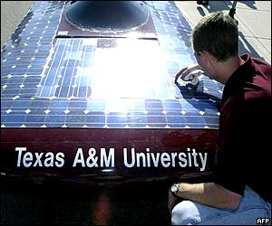 Student wipes the surface of his team's car