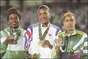 Falilat Ogunkoya (left), Marie Jo Perec (centre) and Cathy Freeman display their Olympic medals in Atlanta