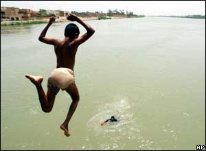 A child dives into the Tigris river, Iraq