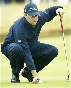 Davis Love III lines up a putt