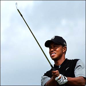 Tiger Woods drives at the 15th