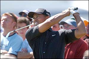 Tiger Woods tees off on the third hole