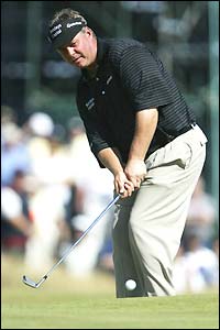 Darren Clarke chips onto the green