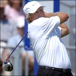 Greg Norman plays a drive