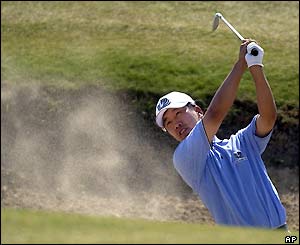 Korea's SK Ho plays from a bunker on the second hole at Sandwich