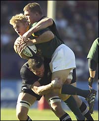 South Africa's Brent Russell is stopped in his tracks by the Kiwi defence