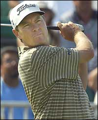 Davis Love III hits a tee shot