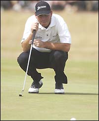 Thomas Bjorn lines up a putt