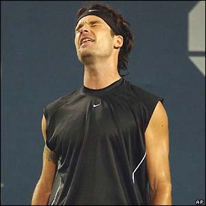 Carlos Moya grimaces during his fourth-round defeat