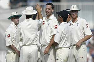 England's players celebrate dismissing Mark Boucher