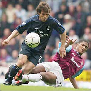Former Chelsea star Gianfranco Zola is tackled by new Blues signing Glen Johnson, pictured playing for West Ham 