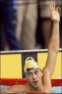 Matt Welsh celebrates victory in the men's 50 metres butterfly final