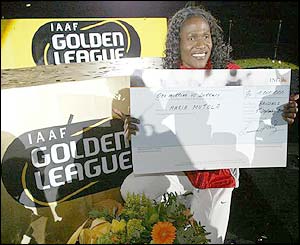 Mozambique's Maria Mutola with a cheque for one million dollars