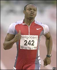 Asafa Powell wins the men's 100m