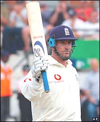 Graham Thorpe salutes the crowd on reaching his fifty