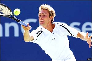 Juan Carlos Ferrero stretches for a forehand