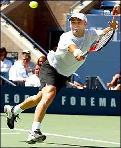 Andre Agassi stretches for a backhand