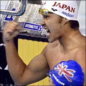 Japan's Kosuke Kitajima celebrates his record-breaking swim