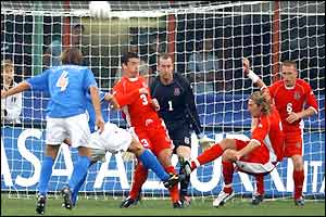 Robbie Savage hooks clear a chance