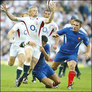 Iain Balshaw holds on to the ball as he breaksaway from the French defence