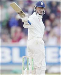 Stewart lifts his bat after reaching a half-century against Zimbabwe in June this year