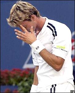Juan Carlos Ferrero looks downcast as he loses the second set