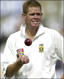 Shaun Pollock tosses the ball to himself