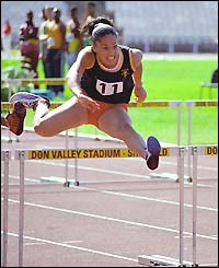 Katey Reed hurdles at the English Schools' Athletics Championships at the Don Valley Stadium in Sheffield, by Ian Bedford