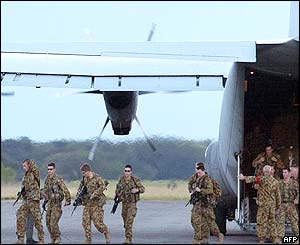Australian troops arrive aboard a RAAF C-130 Hercules 