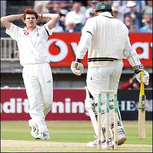 Jimmy Anderson puts his hands to his head as Graeme Smith survives another delivery