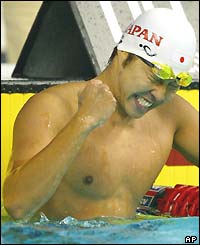 Japan's Kosuke Kitajima celebrates setting a new 200m breaststroke world record