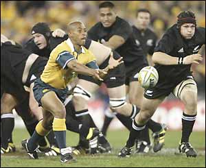 Australia captain George Gregan spreads the ball wide