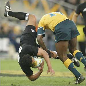 Wendell Sailor puts in a bruising and illegal tackle on Mils Muliaina