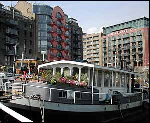 Boats on moorings by new developments