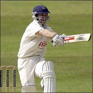 Tim Ambrose belts the ball 