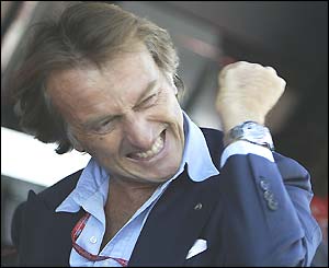 Luca di Montezemolo, Ferrari's Italian president, clenches his fist to celebrate Michael Schumacher taking pole